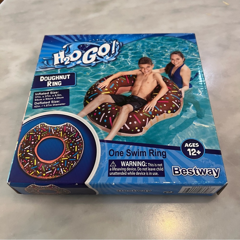 Doughnut float.  New in box. H2O Go! Doughnut Swim Ring - Brown
